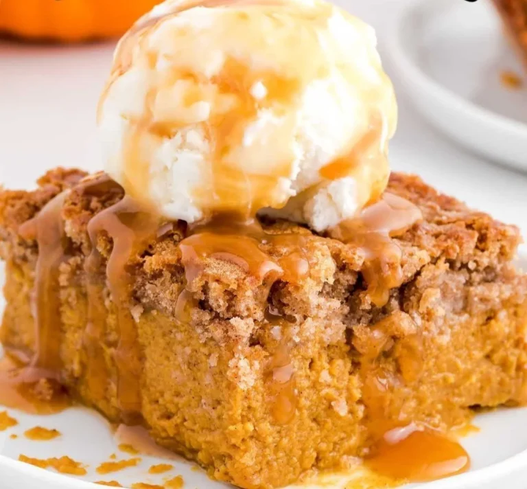 Delicious Pumpkin Spice Dump Cake served on a plate with autumn decorations.
