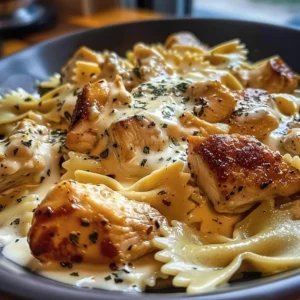 Cheesy Garlic Butter Chicken Bowtie pasta with Mozzarella Cream Sauce on a plate