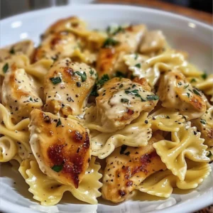 Cheesy garlic butter chicken bowties with mozzarella cream sauce on a plate.