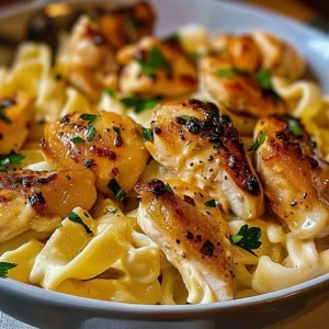 Garlic Butter Chicken Bites served with creamy Parmesan pasta