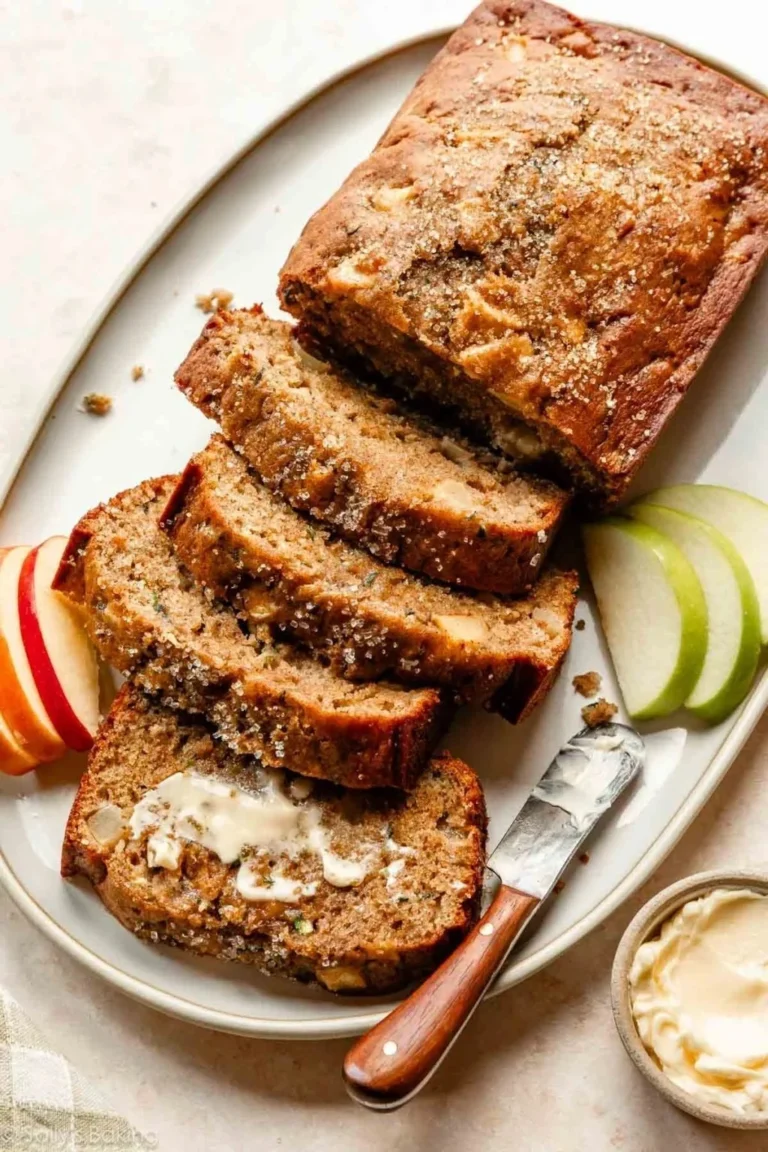 Moist Apple Zucchini Bread slice on a wooden table