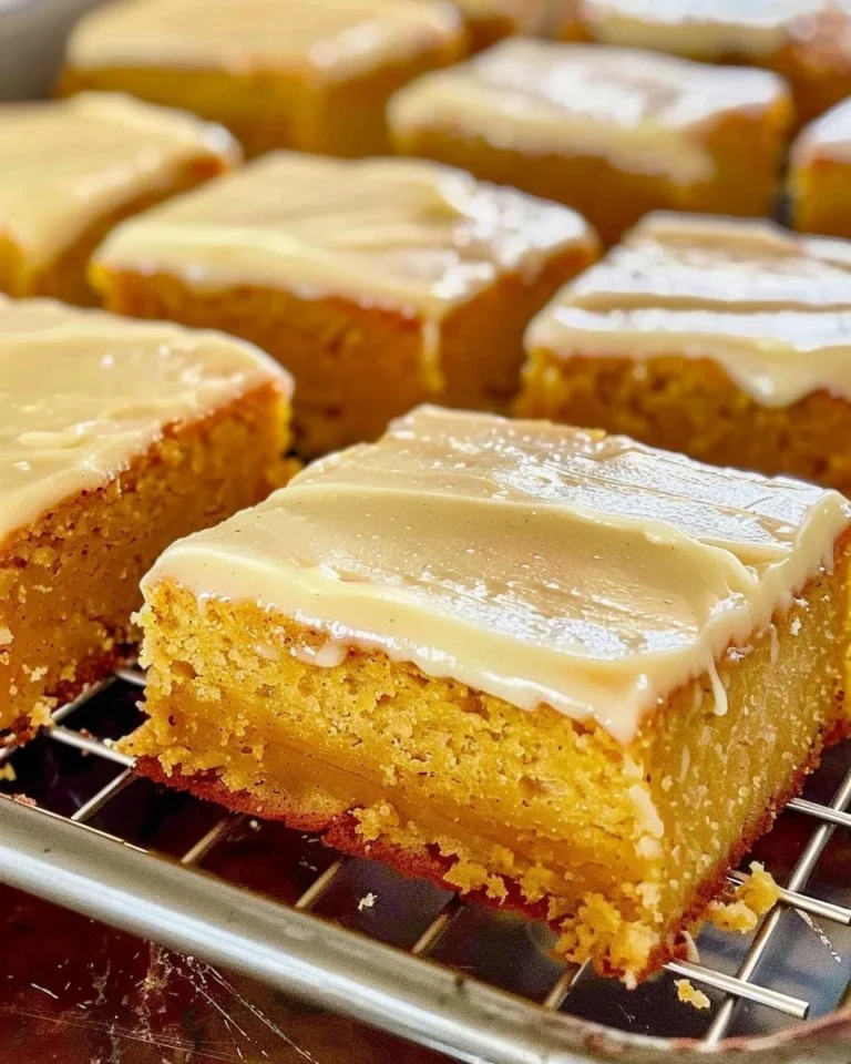 Pumpkin sheet cake with brown butter icing served on a plate